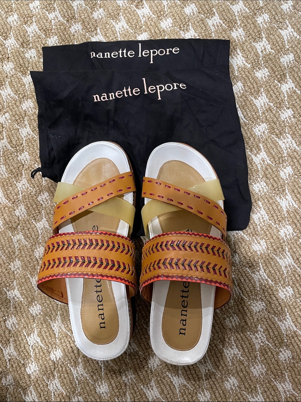 Nanette Lepore pink , Tan & white Leather Slide Mules
Black rubber soles